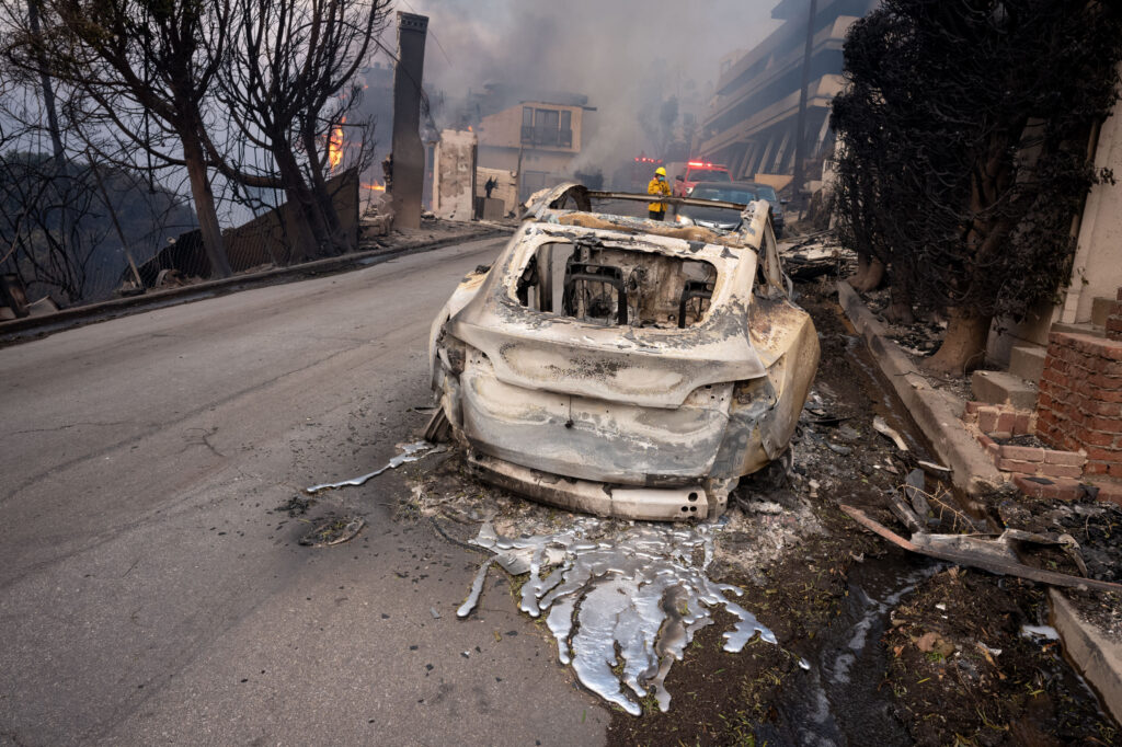 Burning Teslas add to toxic mix of pollution delaying LA return